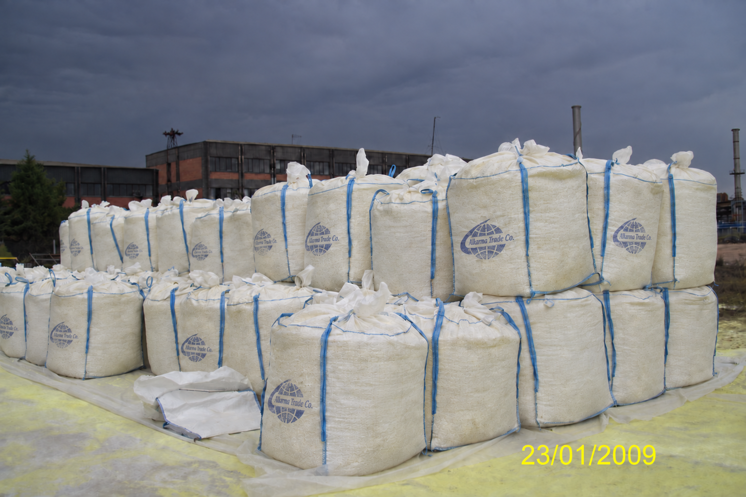 Bulk bags of minerals being loaded into a ship hold for export — Al Karma Group company archive